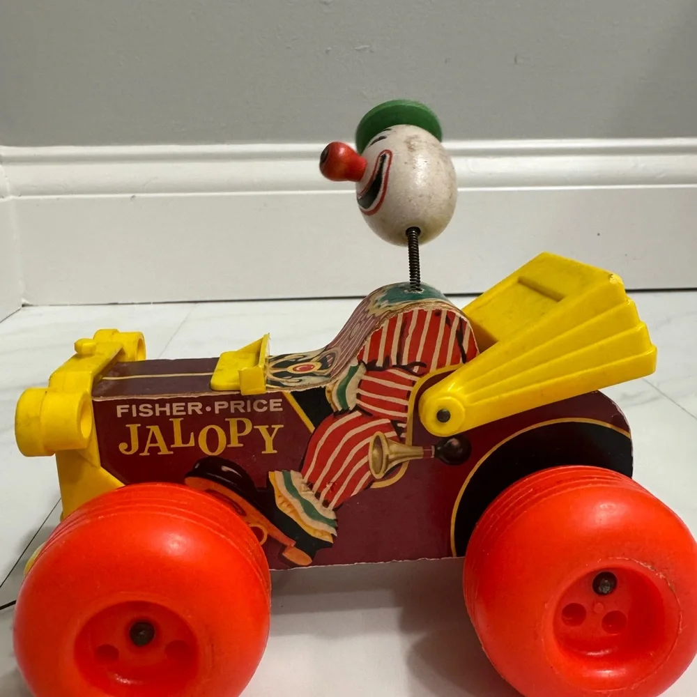 Vintage Fisher Price Jolly Jallopy pull toy from 1974.